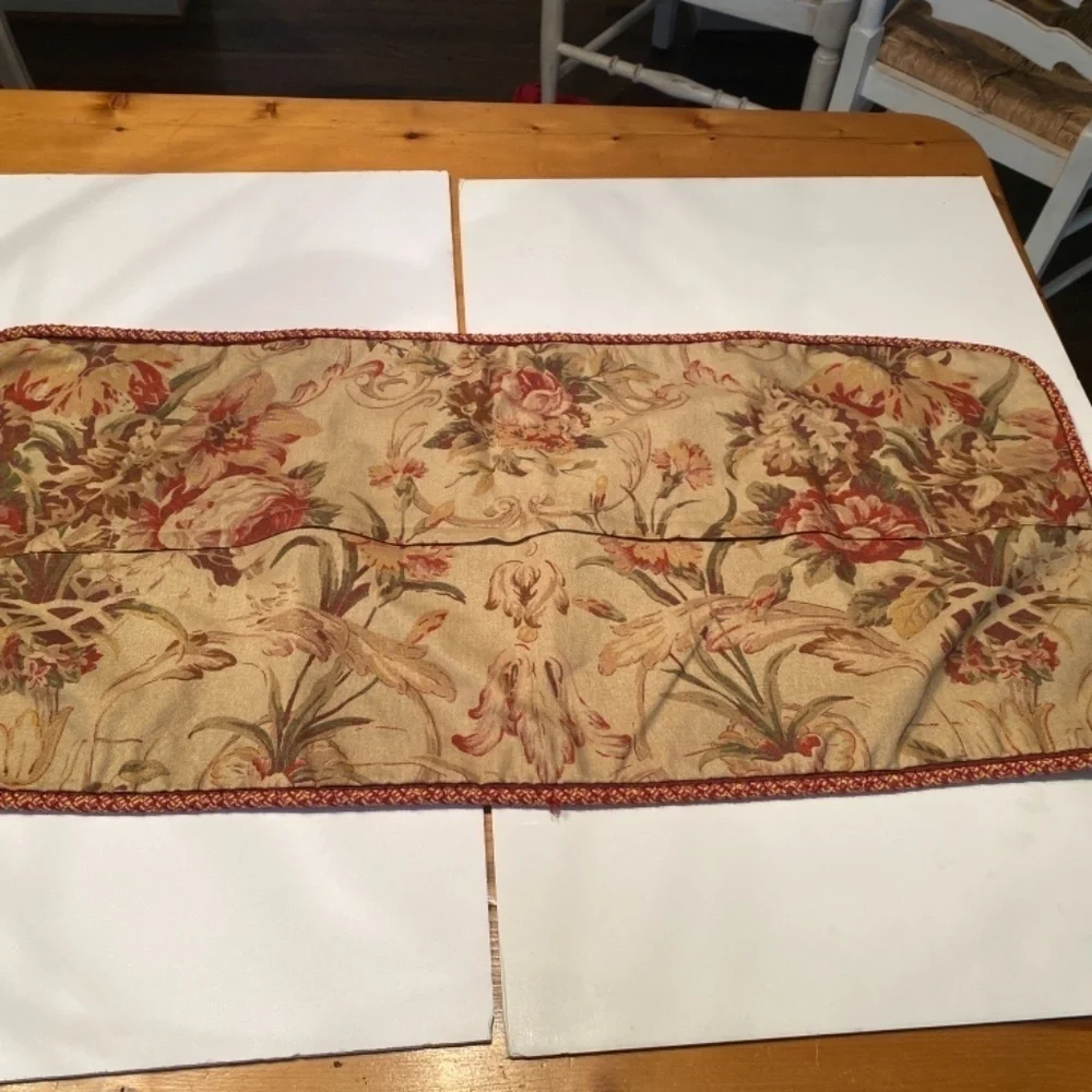 Red and brown pillow covers with zipper and cording. 35” wide 15” depth.